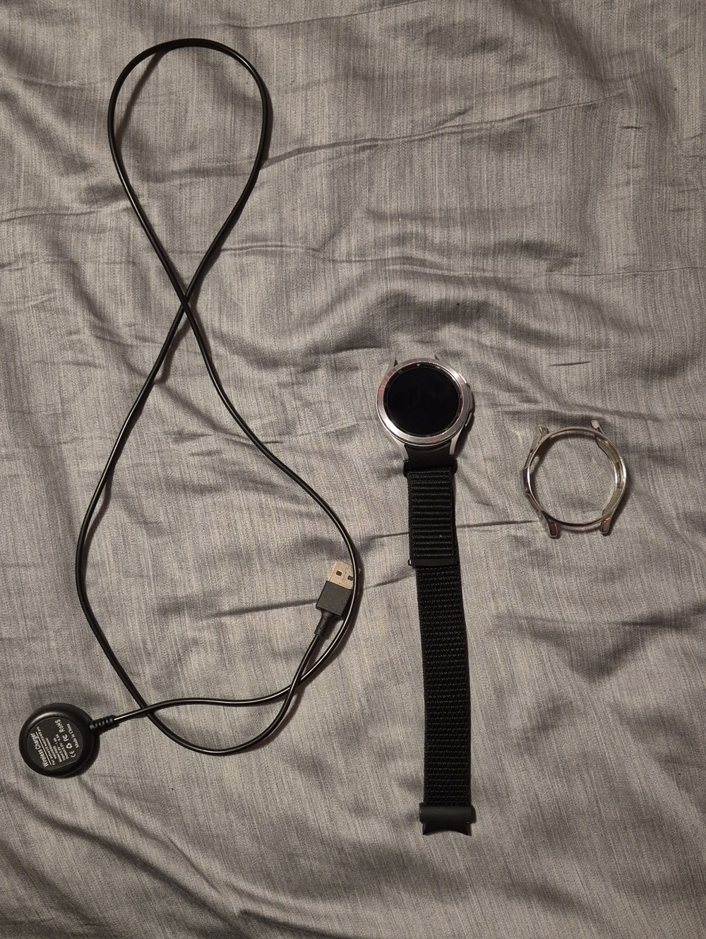 Samsung GALAXY Watch 4 Classic With Silver Shell, Velcro Wristband, and Charger